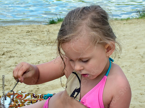 Little girl on the river bank