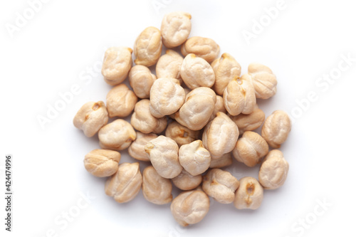 Macro Close-up of Organic chhole chana or Kabuli chana (Cicer arietinum) or whole white Bengal gram dal cleaned on a white background. Top view