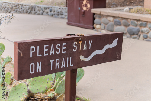 please stay on the trail sign at Montezuma Castle is the third National Monument dedicated to preserving Native American culture sedona arizona  photo