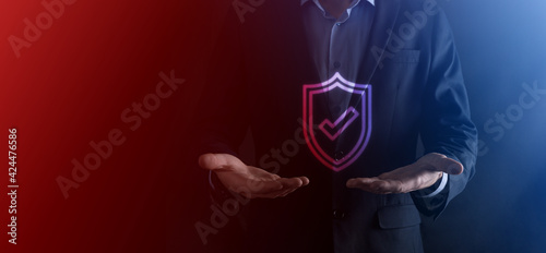 Protection network security computer in the hands of a businessman. business, technology, cyber security and internet concept - businessman pressing shield button on virtual screens Data protection © Ivan