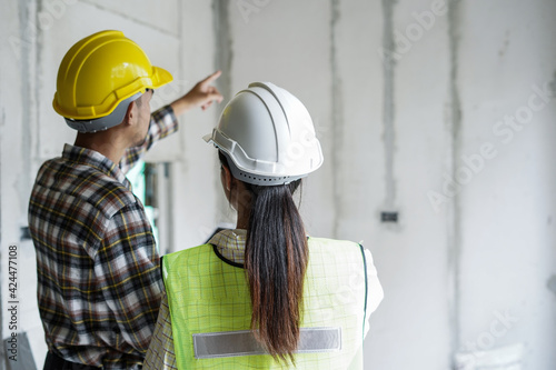 Canvas Print Team of worker inspector or engineers is checking inspecting and discussing plan to renovation the building or house