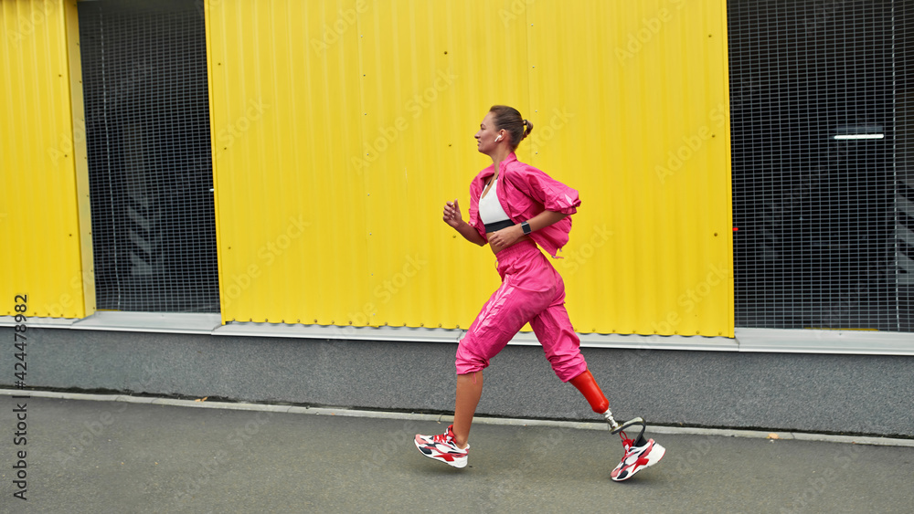 Disabled sports woman running outdoors Disabled sports woman running outdoors