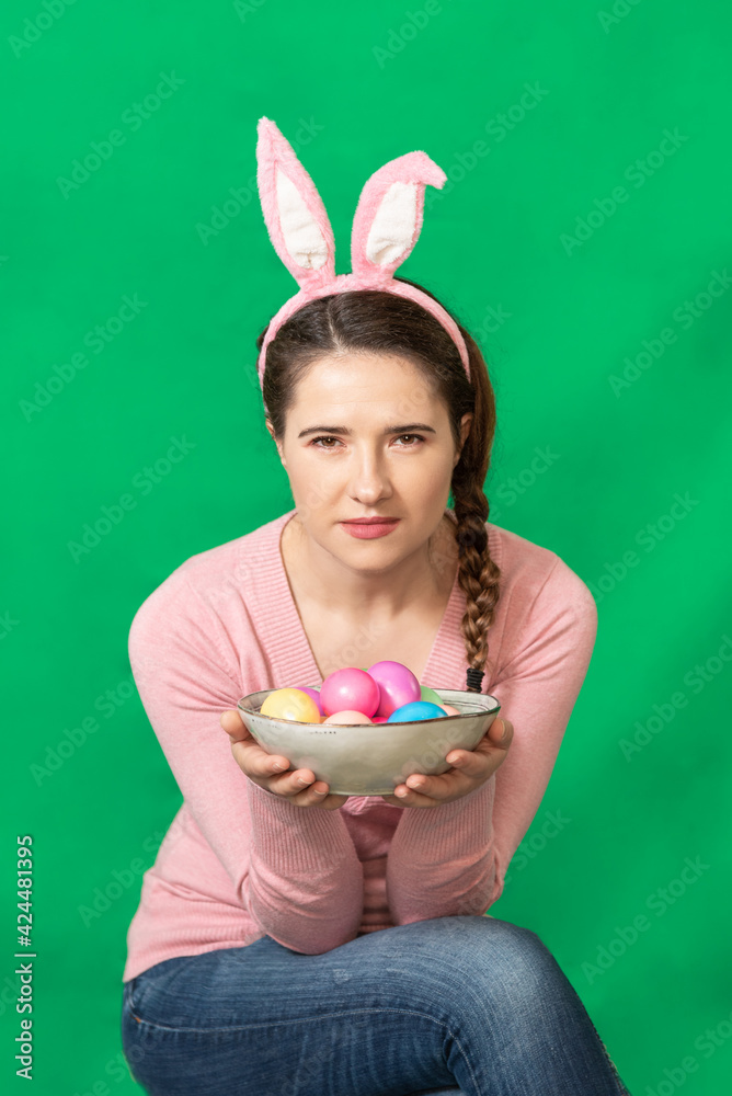 Happy young woman wearing bunny ears. Happy young woman wearing bunny ears.