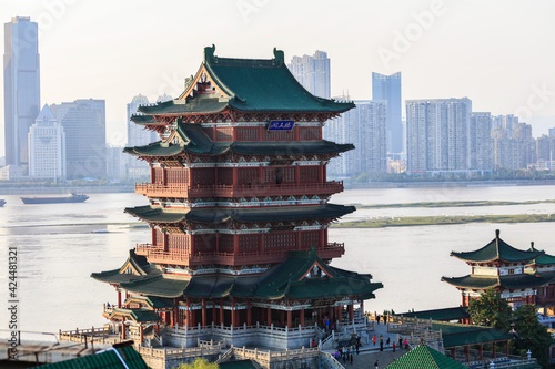 A bird's eye view of the Tengwang Pavilion, an ancient Chinese attic in the Tang Dynasty, on the bank of the Ganjiang River at sunset.（The Chinese characters in the photo read: Pavilion of King Teng）