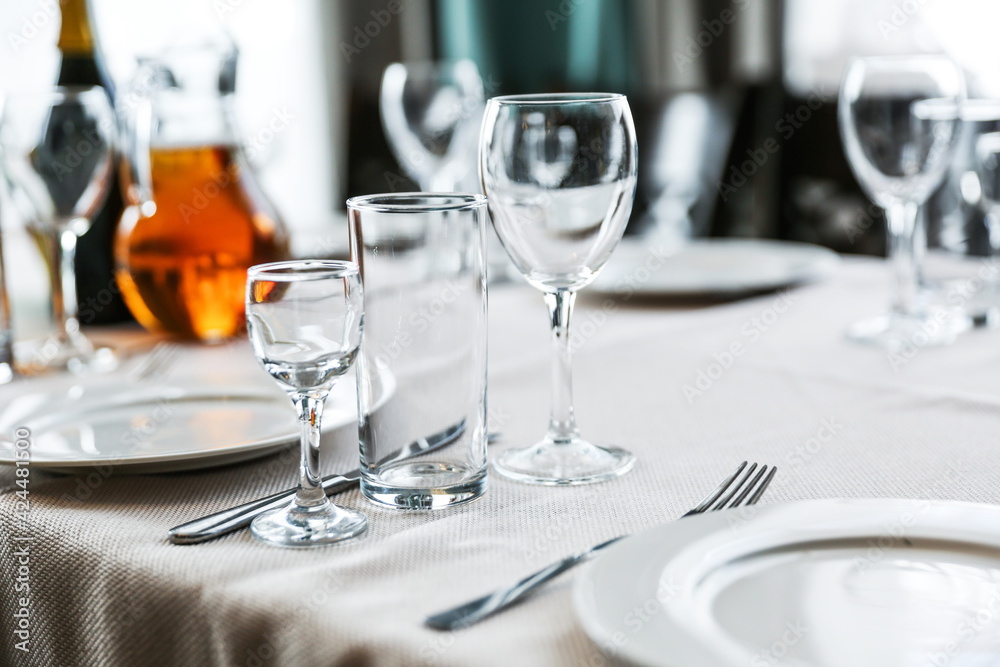 glasses on a served table in a restaurant glasses on a served table in a restaurant