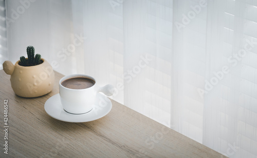cup of hot cocoa on wood table