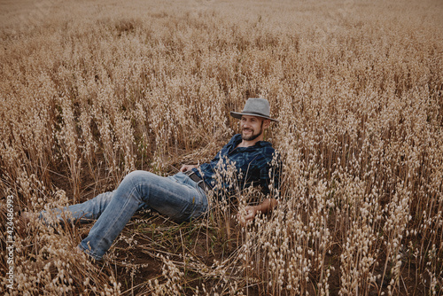 A man in the field, the rye is ripe for a crop of cereals.