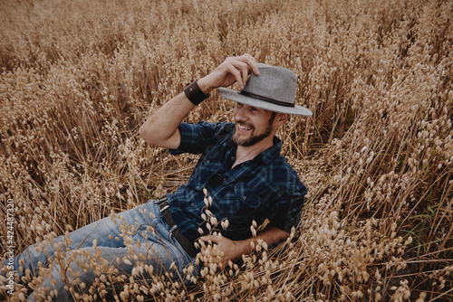A man in the field, the rye is ripe for a crop of cereals.
