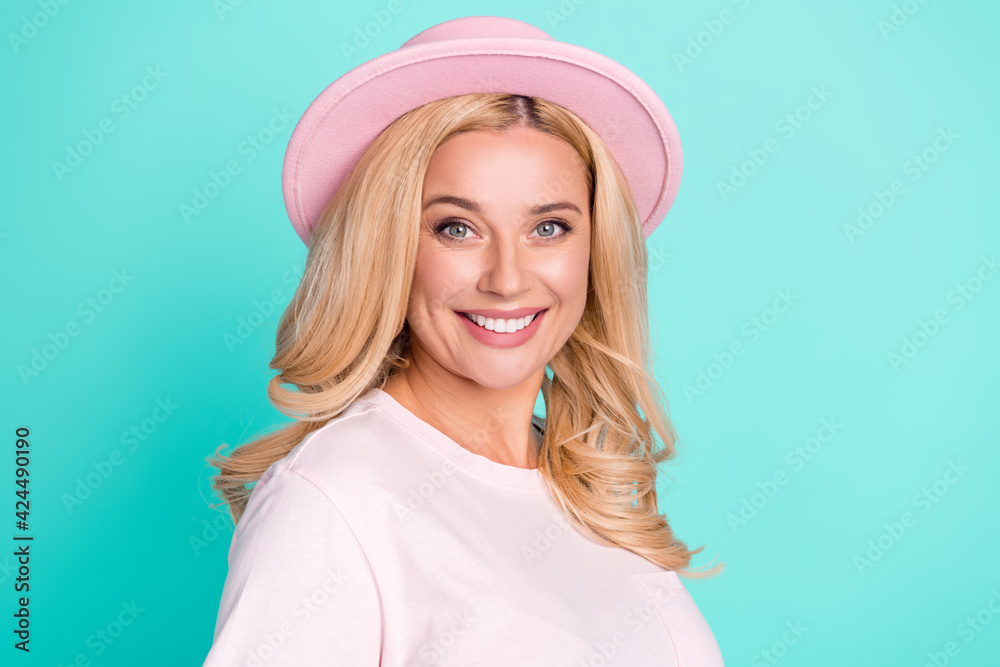 Portrait of attractive cheerful wavy-haired woman wearing spring look isolated over bright teal turquoise color background Portrait of attractive cheerful wavy-haired woman wearing spring look isolated over bright teal turquoise color background