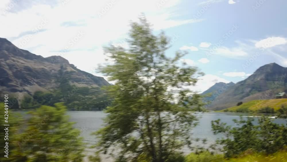 WATERTON, AB, CANADA - JULY 2019: Smooth & cinematic gimbal views of Lake & Peaks in Waterton National Park WATERTON, AB, CANADA - JULY 2019: Smooth & cinematic gimbal views of Lake & Peaks in Waterton National Park