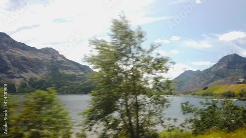 WATERTON, AB, CANADA - JULY 2019: Smooth & cinematic gimbal views of Lake & Peaks in Waterton National Park photo