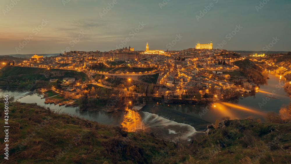Aerial view illuminated with night street lights Toledo city. Spain