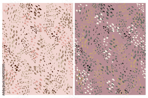 Cute Simple Abstract Wild Animal Skin Print. Irregular Geometric Seamless Vector Patterns ideal for Fabric, Textile. Hand Drawn Irregular Spots Isolated on a Burgundy and Blush Pink Background.