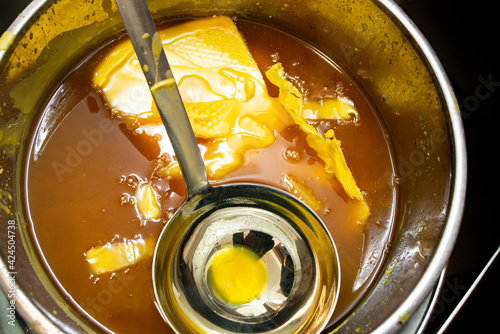 make wax base for honey bee rebuilding., natural beewax and a piece of honey cell