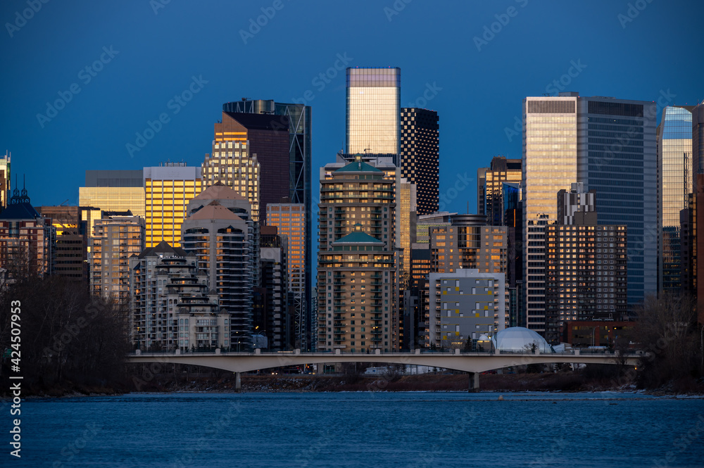 Fototapeta premium Calgary's skyline along the Bow River in the morning.