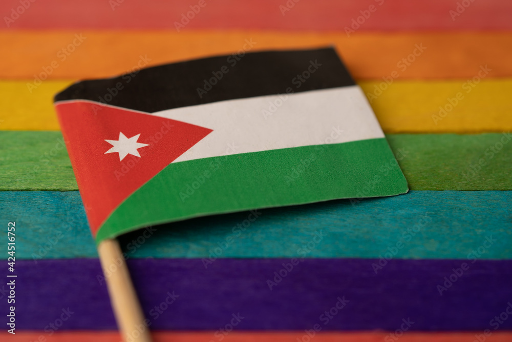 Jordan flag on rainbow background symbol of LGBT gay pride month social  movement rainbow flag is a symbol of lesbian, gay, bisexual, transgender,  human rights, tolerance and peace. Photos | Adobe Stock