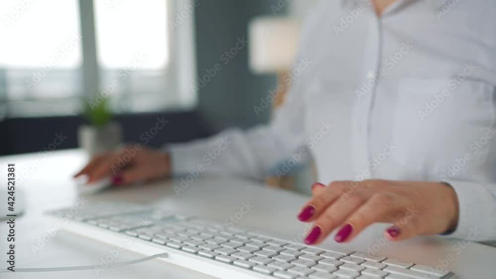 Woman typing on a computer keyboard. Concept of remote work. Woman typing on a computer keyboard. Concept of remote work.