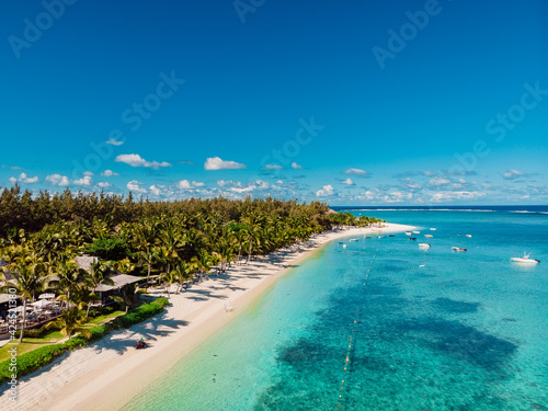 Fototapeta Naklejka Na Ścianę i Meble -  Luxury beach with resort and ocean in Mauritius. Aerial view