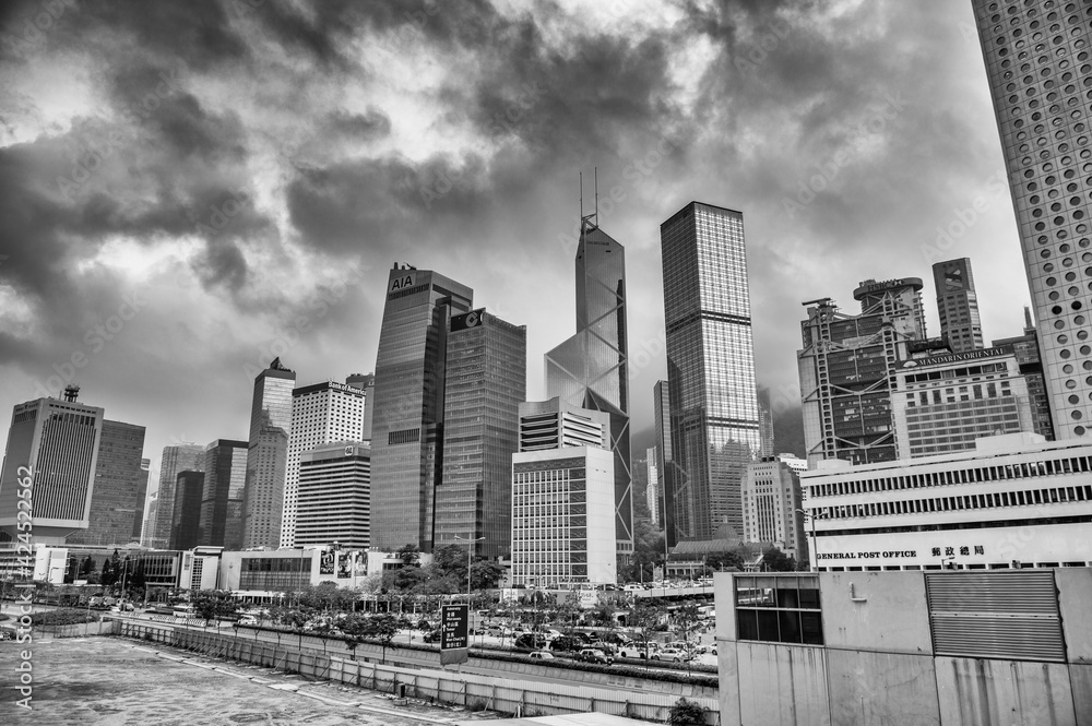 HONG KONG - MAY 2014: Hong Kong skyline from a city street on a cloudy sunset