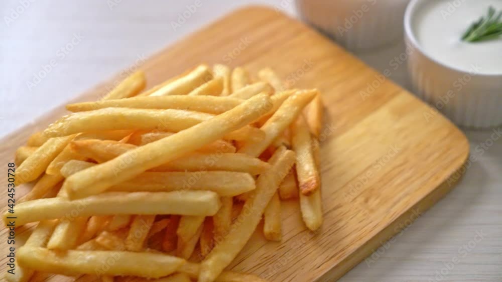 French fries or potato chips with sour cream and ketchup French fries or potato chips with sour cream and ketchup