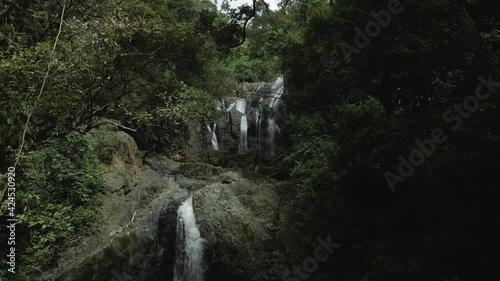 Amazing aerial view of sun and cloud cover of an amazing cascading Argyle waterfall on the tropical island of Tobago photo