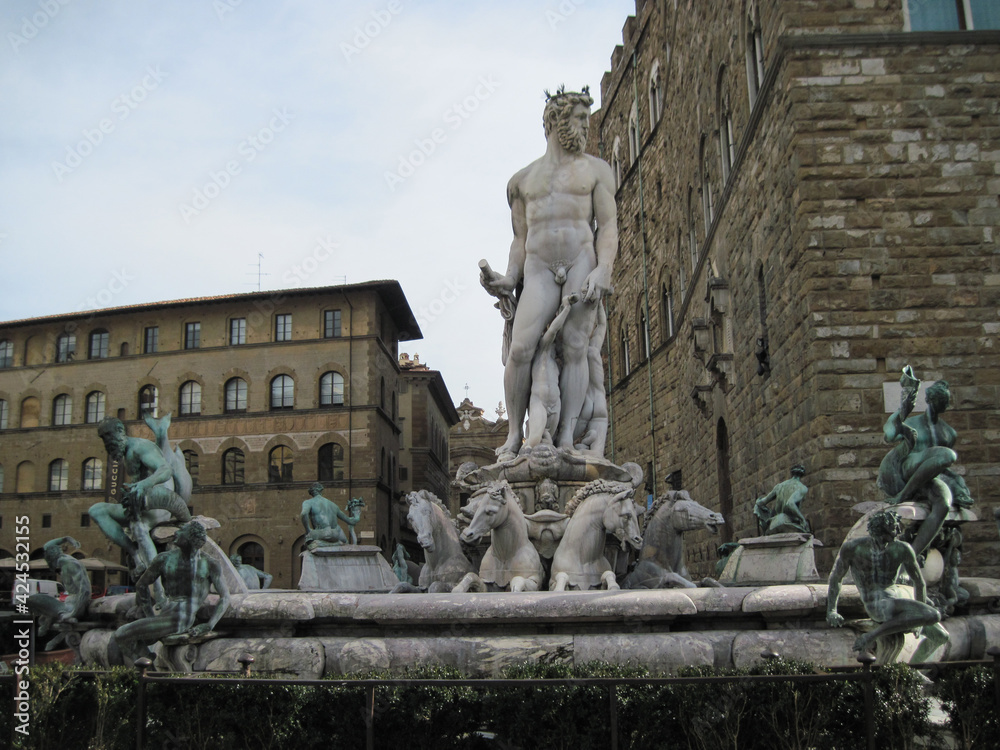 Fountain of Neptune near Palazzo Vecchio. Building in Florence, on Piazza della Signoria. Scenic landscape with Town Hall. Travel to European Union. UNESCO World Heritage Site