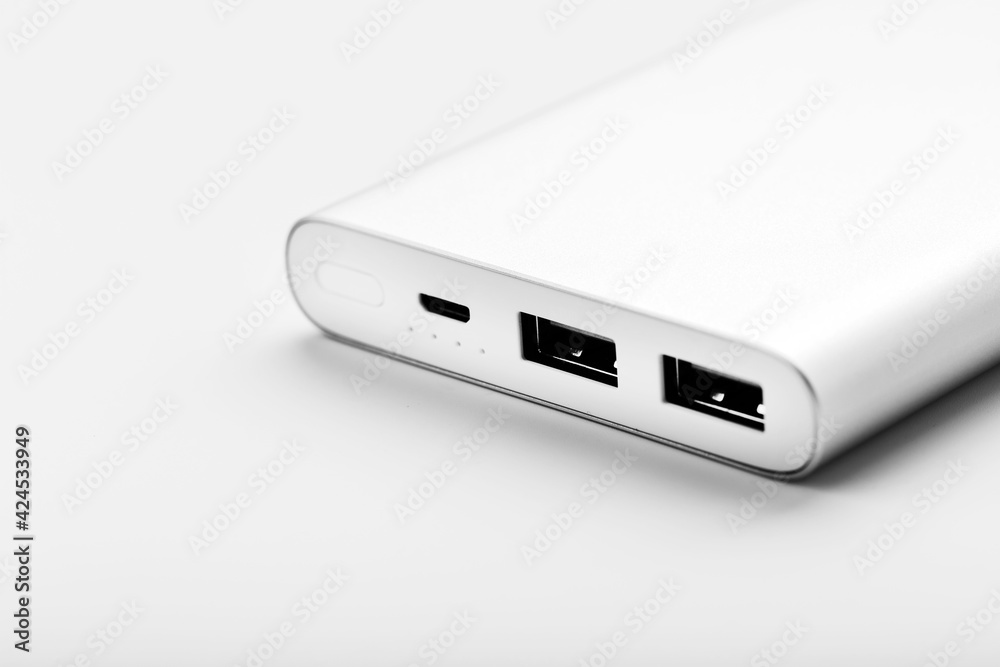 Power bank for charging mobile devices and gadgets on a white background Power bank for charging mobile devices and gadgets on a white background