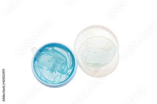 Hydrogel blue eye patches in container. Isolated white background