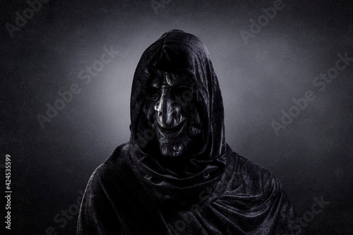 Tableau sur toile Scary witch in hooded cloak