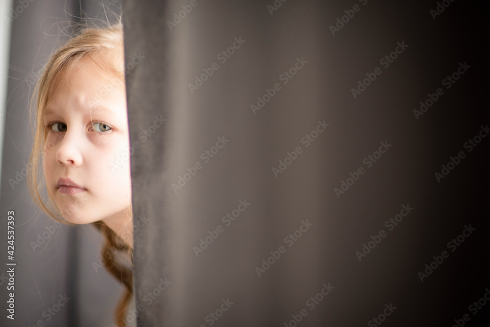 Happy childhood. Emotional portrait of a child in pastel colors, in sunlight, selective focus Happy childhood. Emotional portrait of a child in pastel colors, in sunlight, selective focus