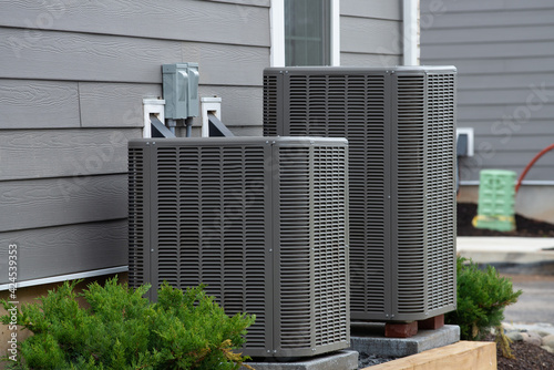 air conditioner near the house unit compressor cool fan photo