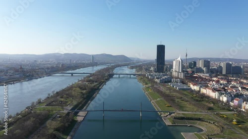 Vienna Danube and City aerial panoramic view. Donaustadt Kagran district at the Danube. Modern city quarter with skyscrapers and business office centres. photo