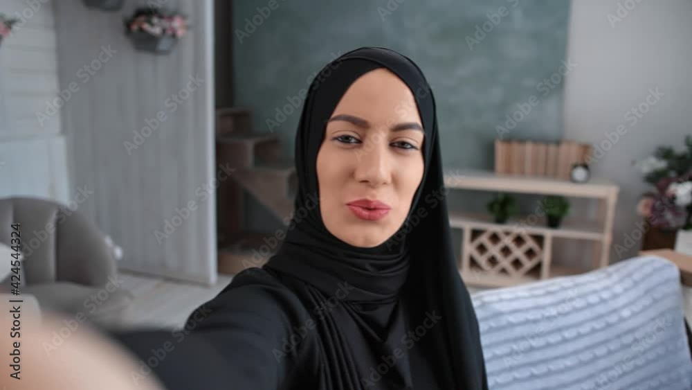 Closeup face Turkey woman with natural beauty posing taking selfie home. Shot with RED camera in 4K Closeup face Turkey woman with natural beauty posing taking selfie home. Shot with RED camera in 4K