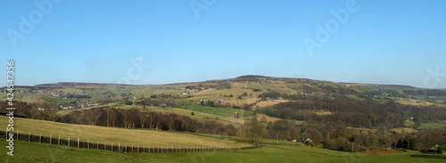 panoramic view of the calder valley in west yorkshire with the village of midgley and dod naze surrounded by fields, woods and moorland