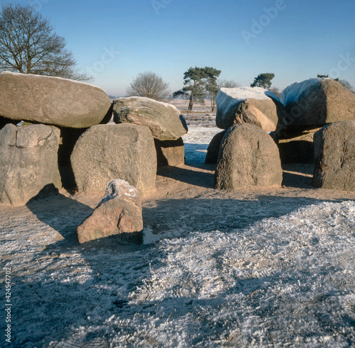 Dolmen Havelte Drente Neherlands. Prehistoric tombstones built by the Funnelbeaker people. Winter. Snow and ice. photo