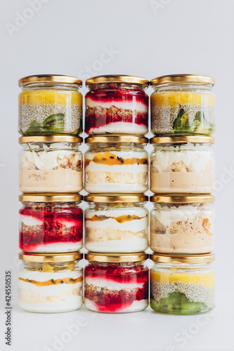 Trendy organic desserts in jars on a solid background. Concept for cafes, restaurants and restaurants with healthy products