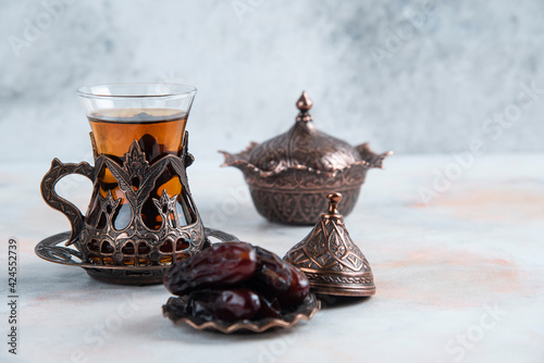 Traditional tea table cups on grey background