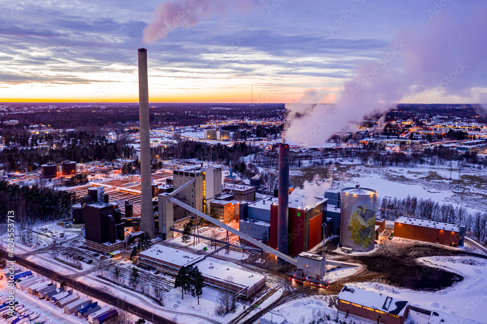 Espoo, Finland - February 15, 2021: Suomenoja combined heat and power plant on the sunset background.
