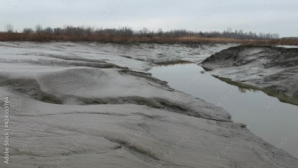 Dry land on river banks during low tide flood in aerial truck shot Dry land on river banks during low tide flood in aerial truck shot