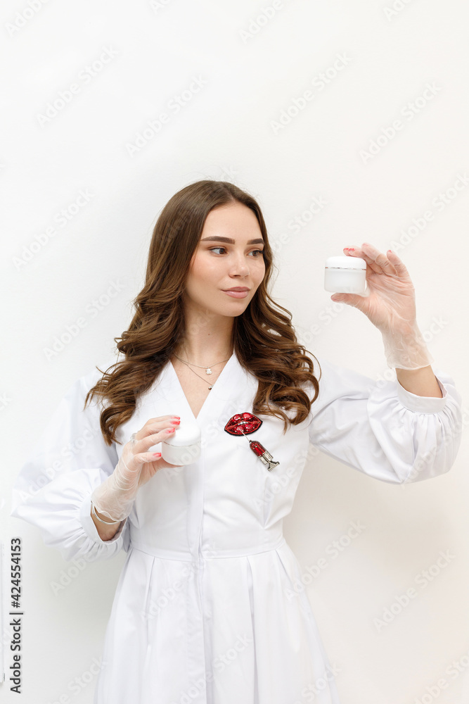 beautician with serum and syringe on a white background beautician with serum and syringe on a white background