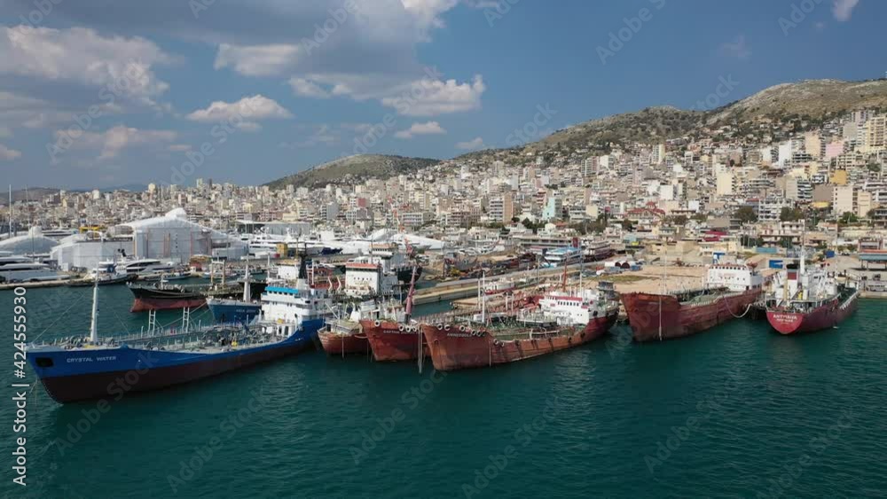 Aerial drone video of industrial shipyards and ship repairs in Perama area next to island of Salamina, Attica, Greece Aerial drone video of industrial shipyards and ship repairs in Perama area next to island of Salamina, Attica, Greece