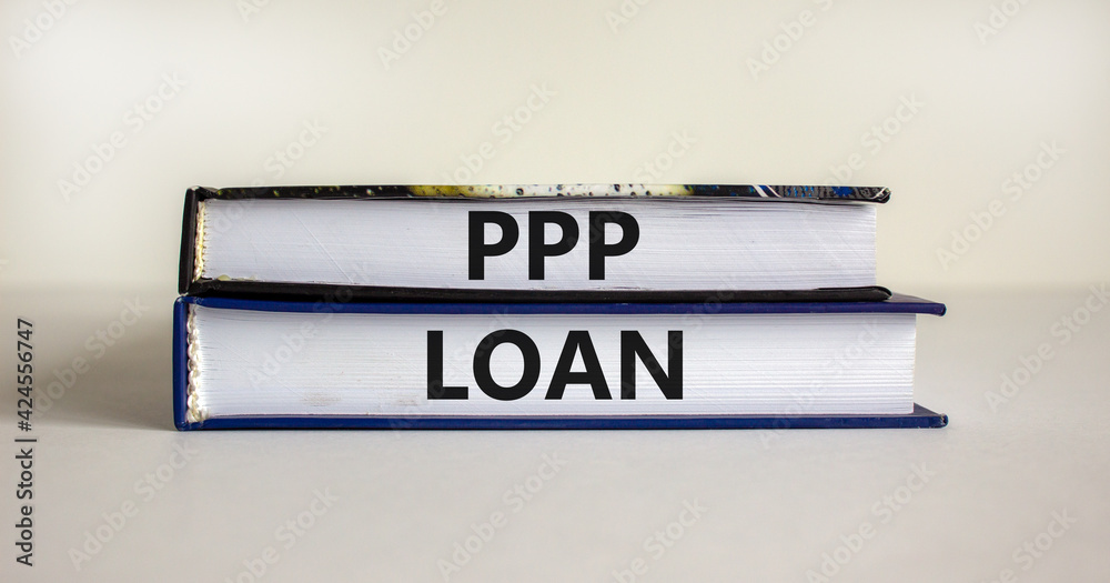 PPP, paycheck protection program loan symbol. Concept words PPP, paycheck protection program loan on books on a beautiful white background. Business, PPP paycheck protection program loan concept.