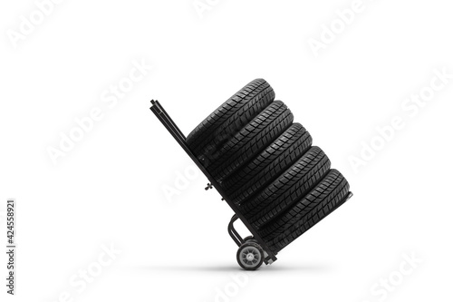 Studio shot of vehicle tires on a hand truck