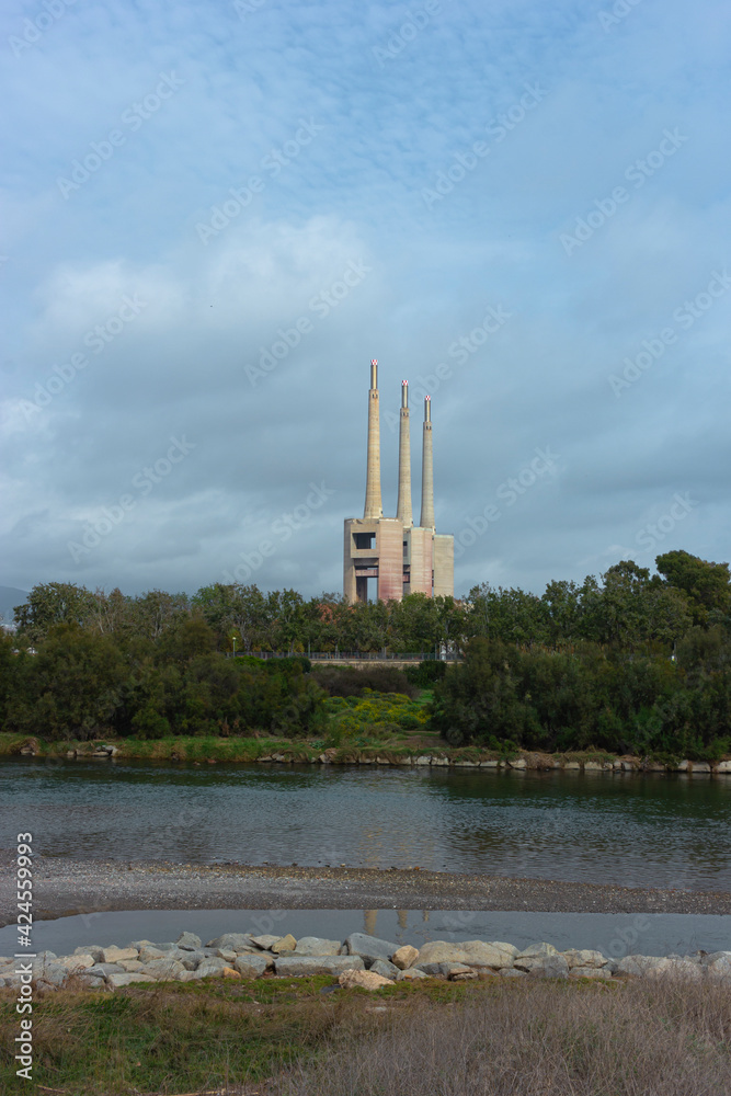 Landscape with an old disused thermal power station for the production of electric energy Landscape with an old disused thermal power station for the production of electric energy
