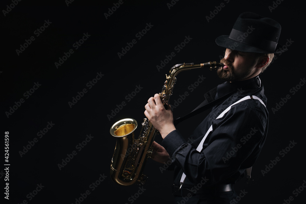 Naklejka premium Man playing on saxophone