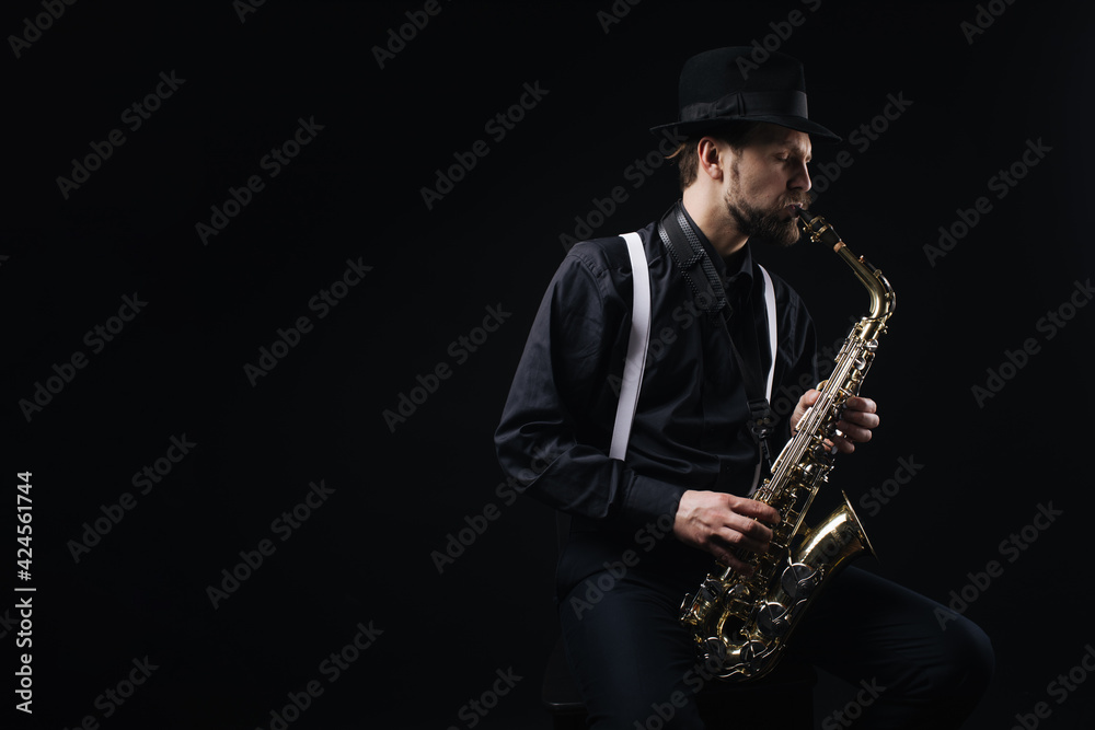 Naklejka premium Man playing jazz on saxophone