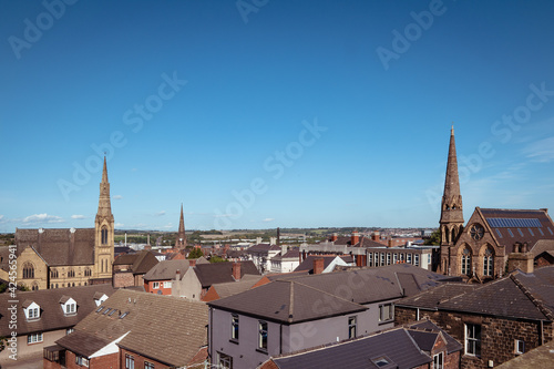 An elevated landscape view over the centre of the town of Rotherham, showing the rooftops with spires of the gothic Minster and Methodist churches and Moorgate Mosque photo