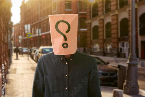 a person with a paper bag on the head with question mark, sign symbol of problem