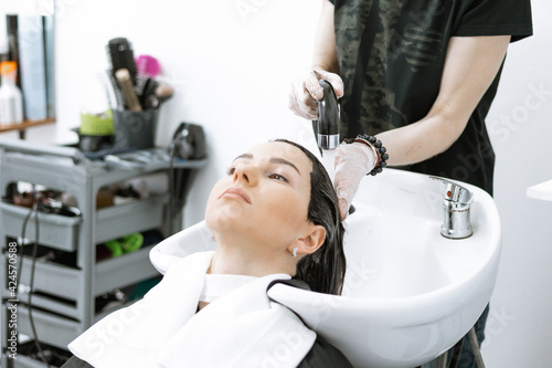 washing off hair care products in the beauty salon, washing hair in the salon
