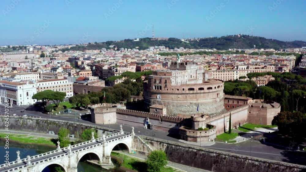 Aerial view of Castel Sant'Angelo, famous monument in Rome, Italy. The Mausoleum of Hadrian in Roma seen from drone flying in sky, with river Tevere. Old buildings and urban landscape of Italian city Aerial view of Castel Sant'Angelo, famous monument in Rome, Italy. The Mausoleum of Hadrian in Roma seen from drone flying in sky, with river Tevere. Old buildings and urban landscape of Italian city